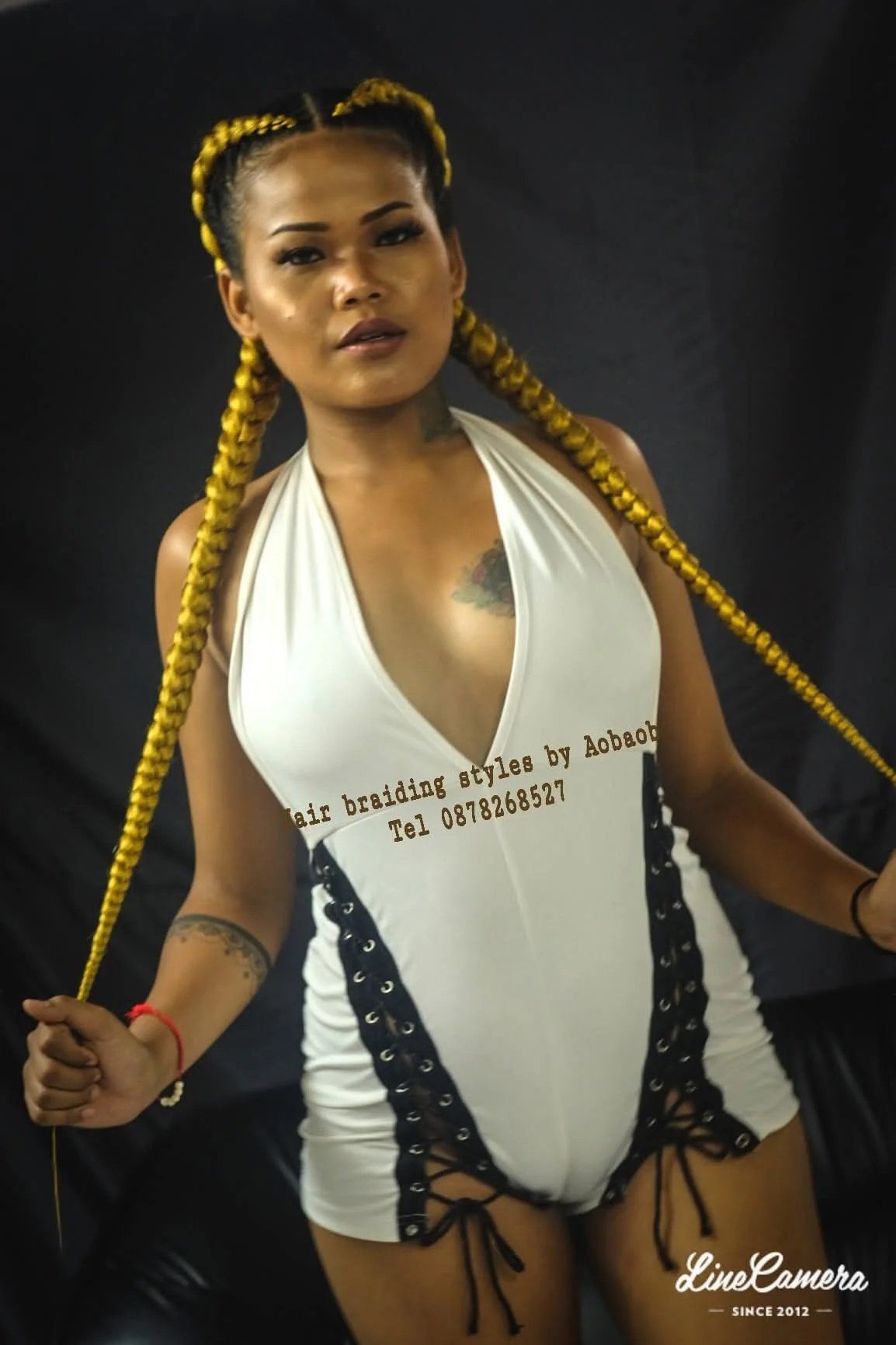 Extra-long sleek braid with yellow accent