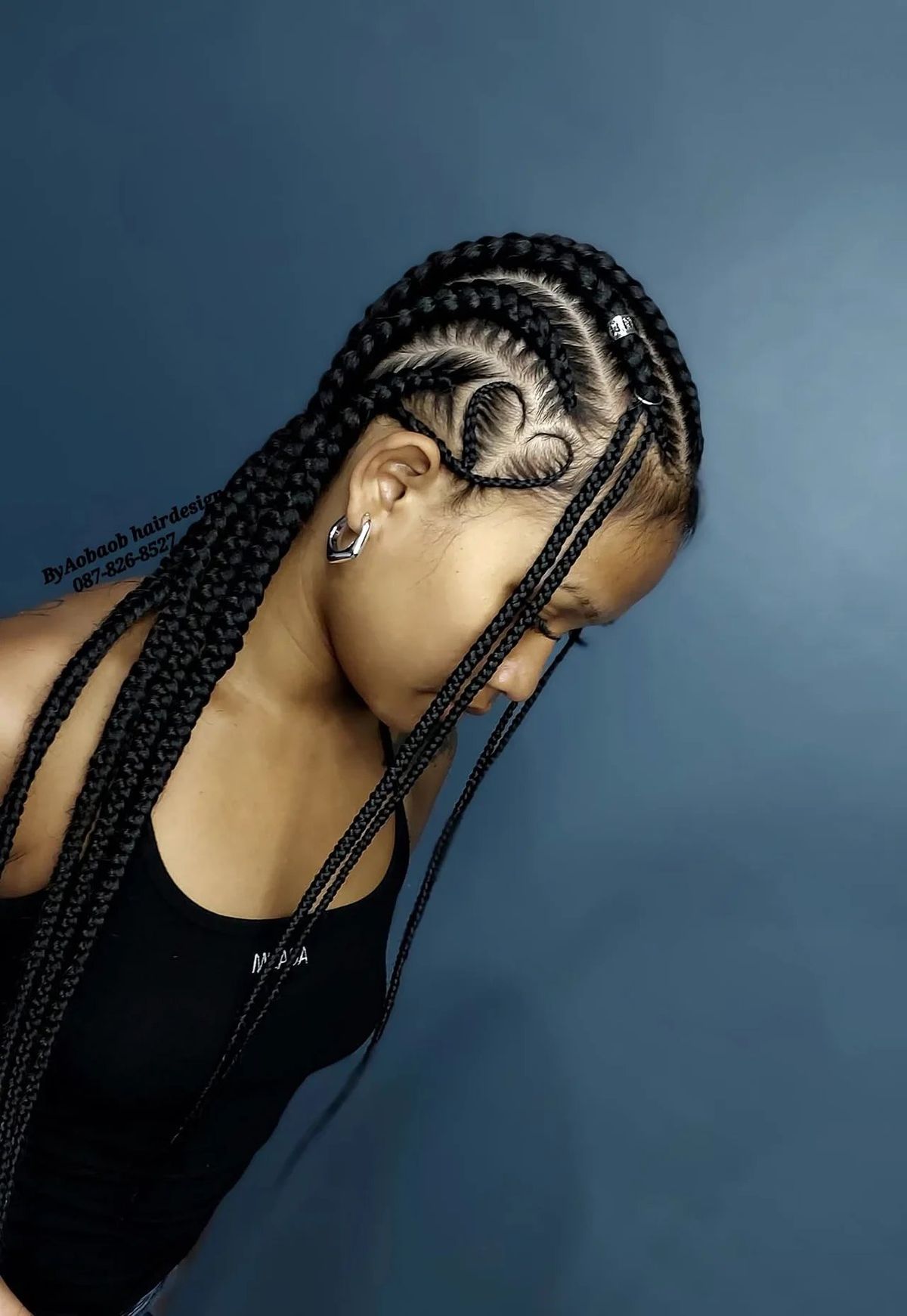 Cornrows with heart design and long braids